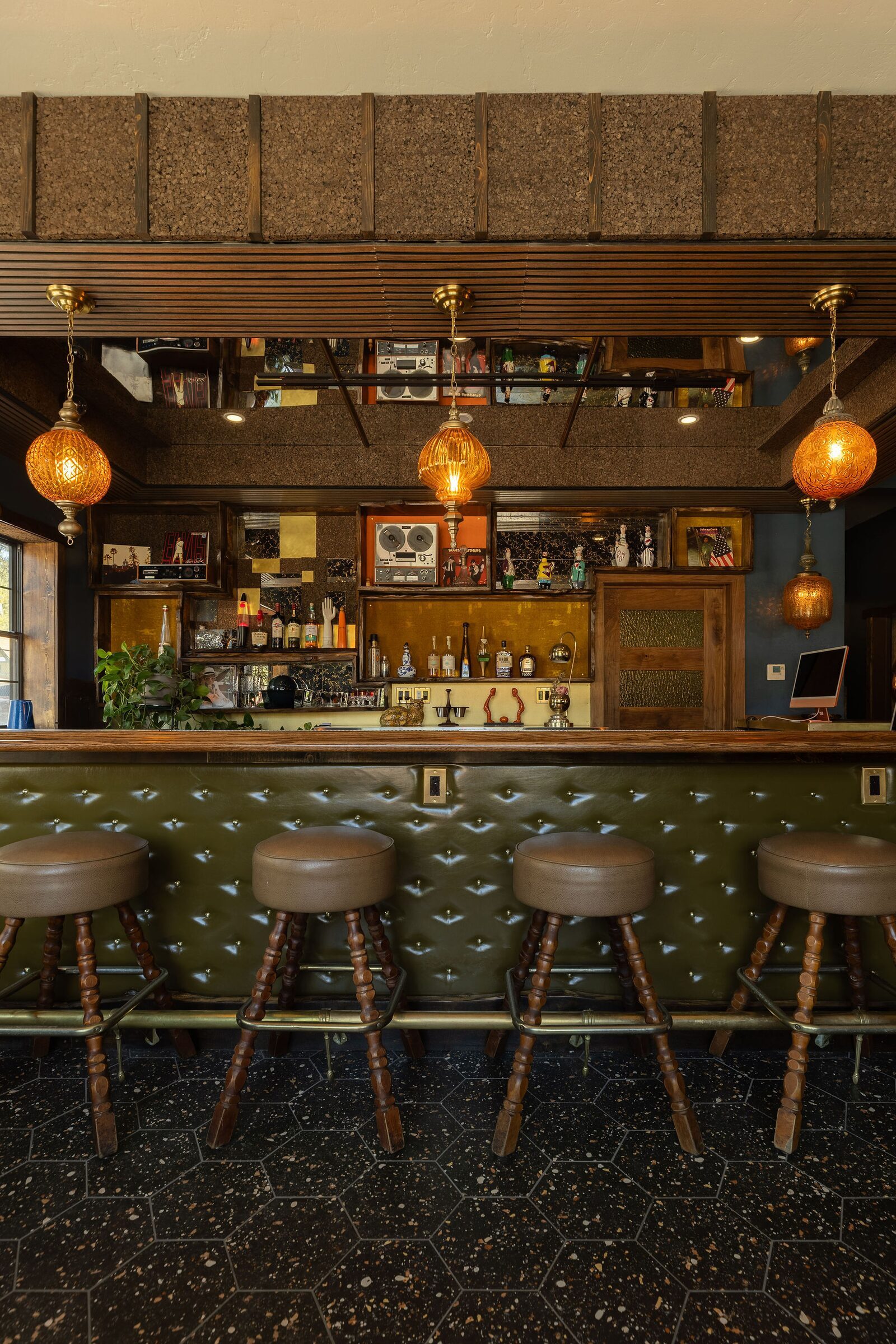 Tufted leather bar seating at The Burgundy