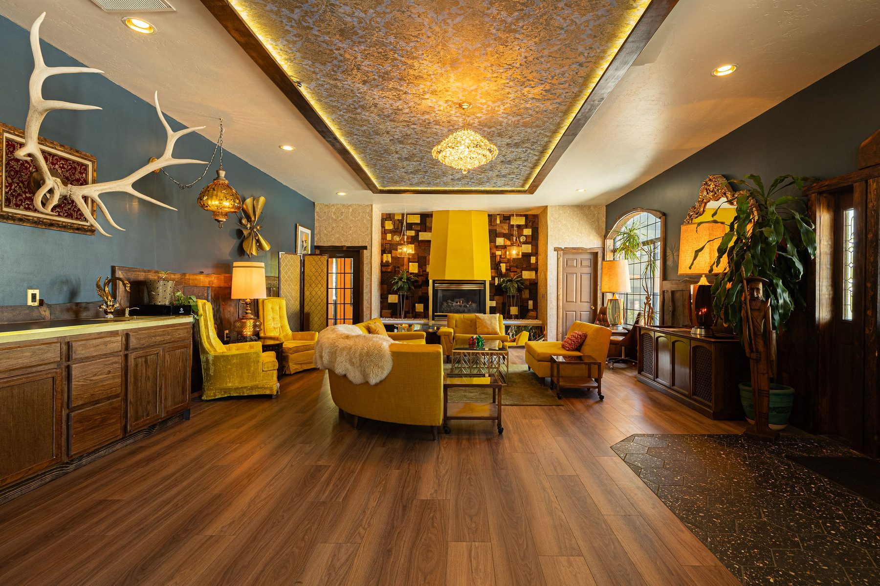 Wide lounge with antler chandelier